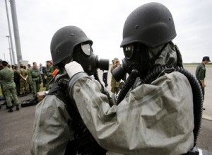 South Korean soldiers in protective gear take part in an NBC exercise at Proliferation Security Initiative Air Interdiction Exercise in Chitose, Japan