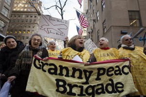 Members of the group "Grandmothers Against the War" hold signs as they protest against the use of drone strikes by the U.S. government in New York